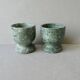 2 marble egg cups in veined white and green, circa 1980.