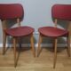 Two vintage chairs wood and mottled red vinyl