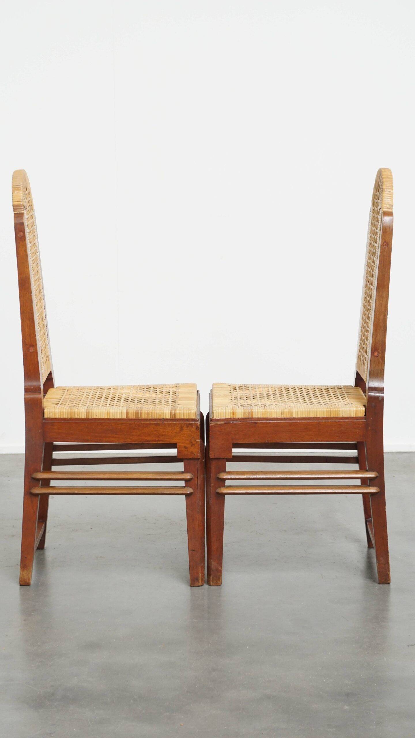 et of 6 wooden Art Deco design dining chairs with a wicker seat and backrest