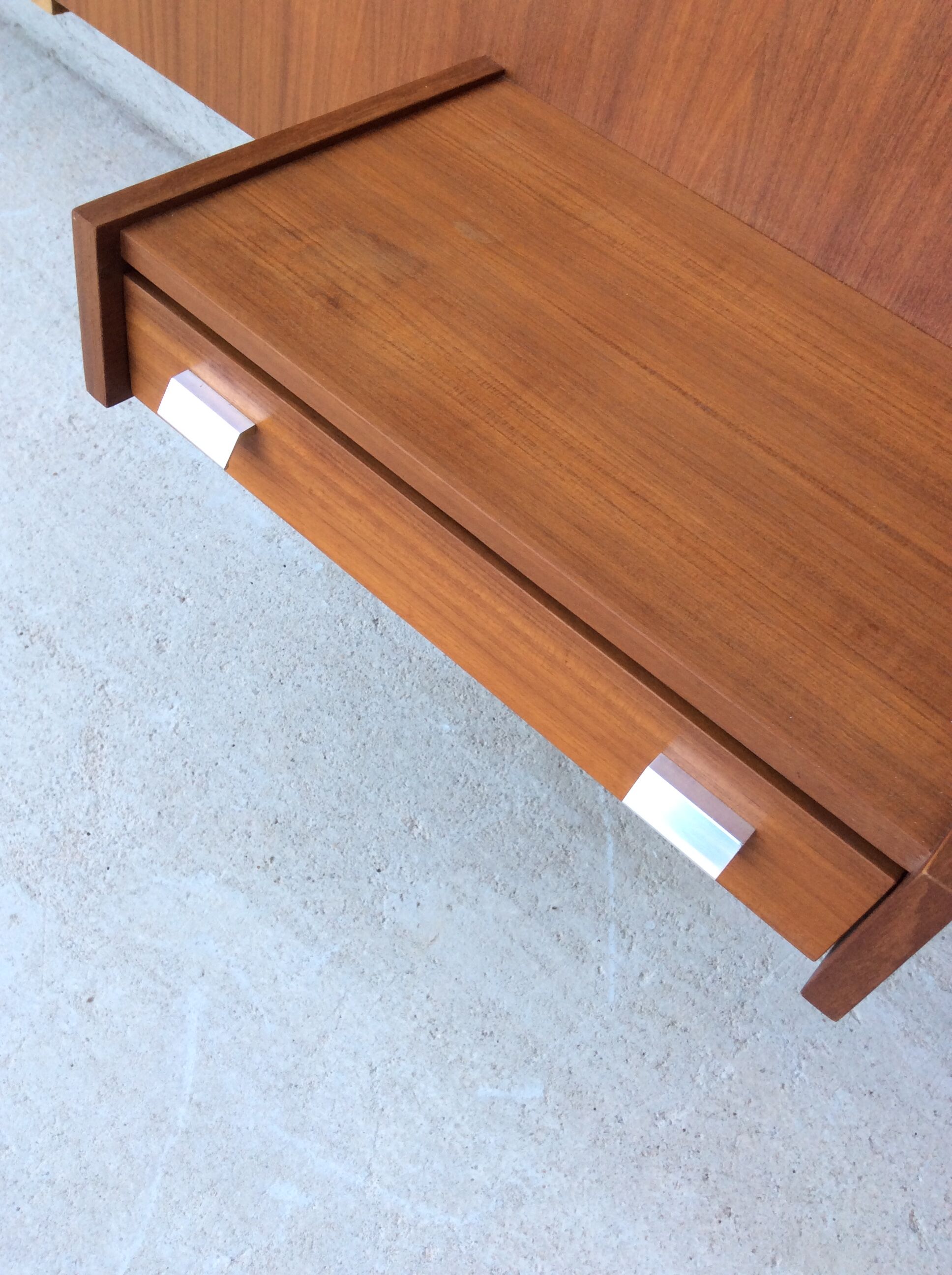 Scandinavian-style teak bed with integrated nightstands