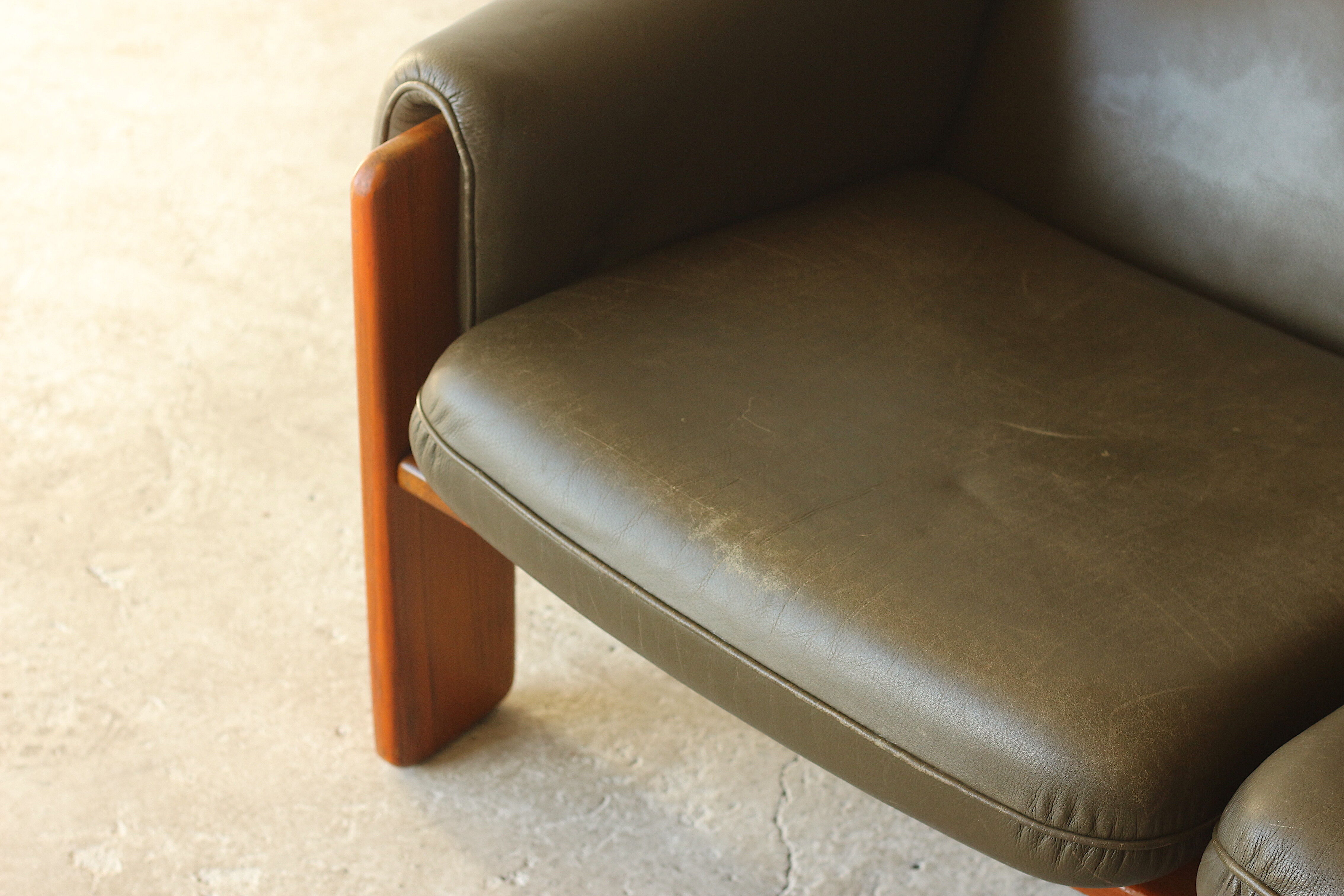 Olive leather two seater sofa, 1970'