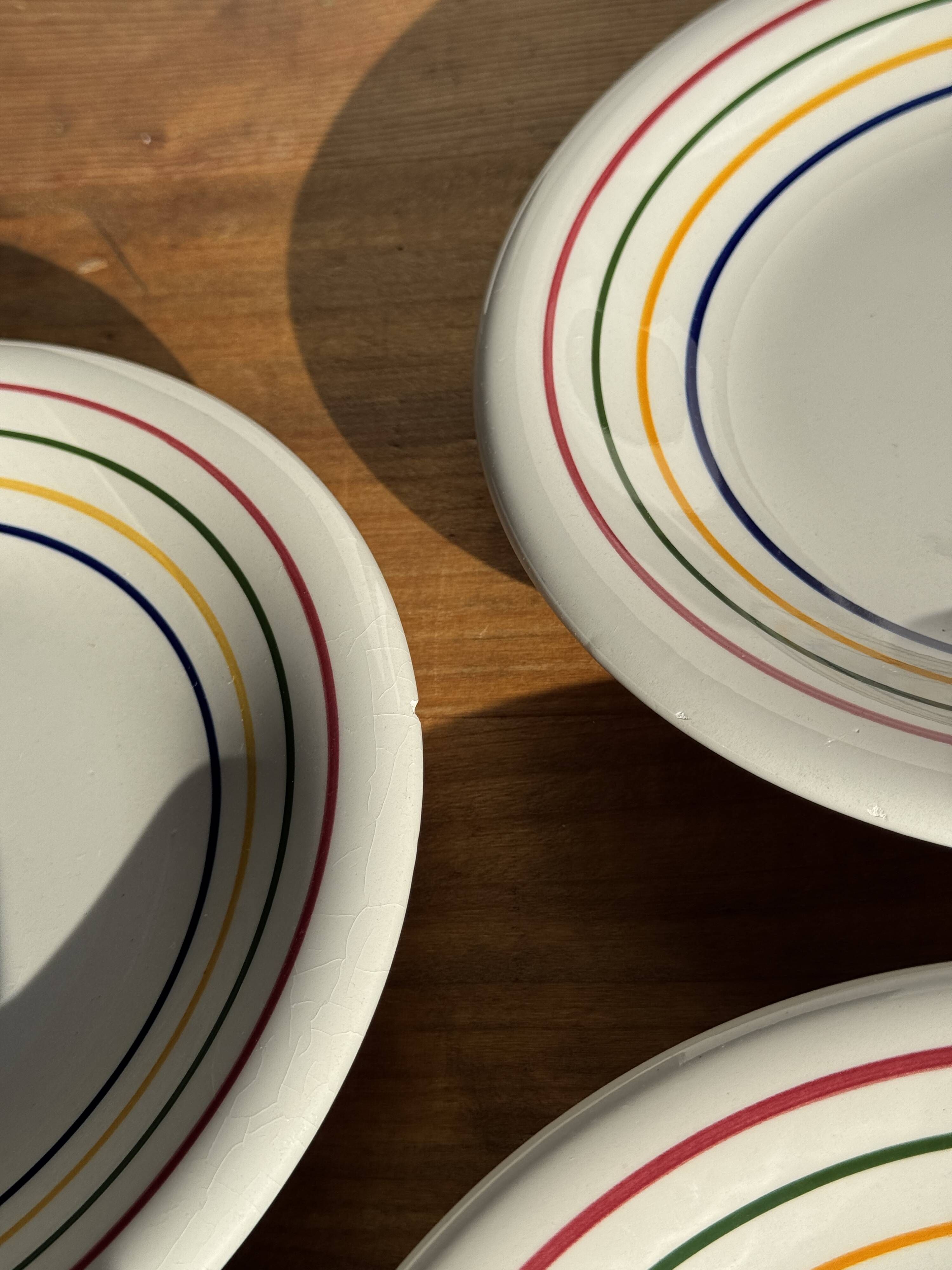 Set of 9 small Italian dessert plates Primula with red and green trim.