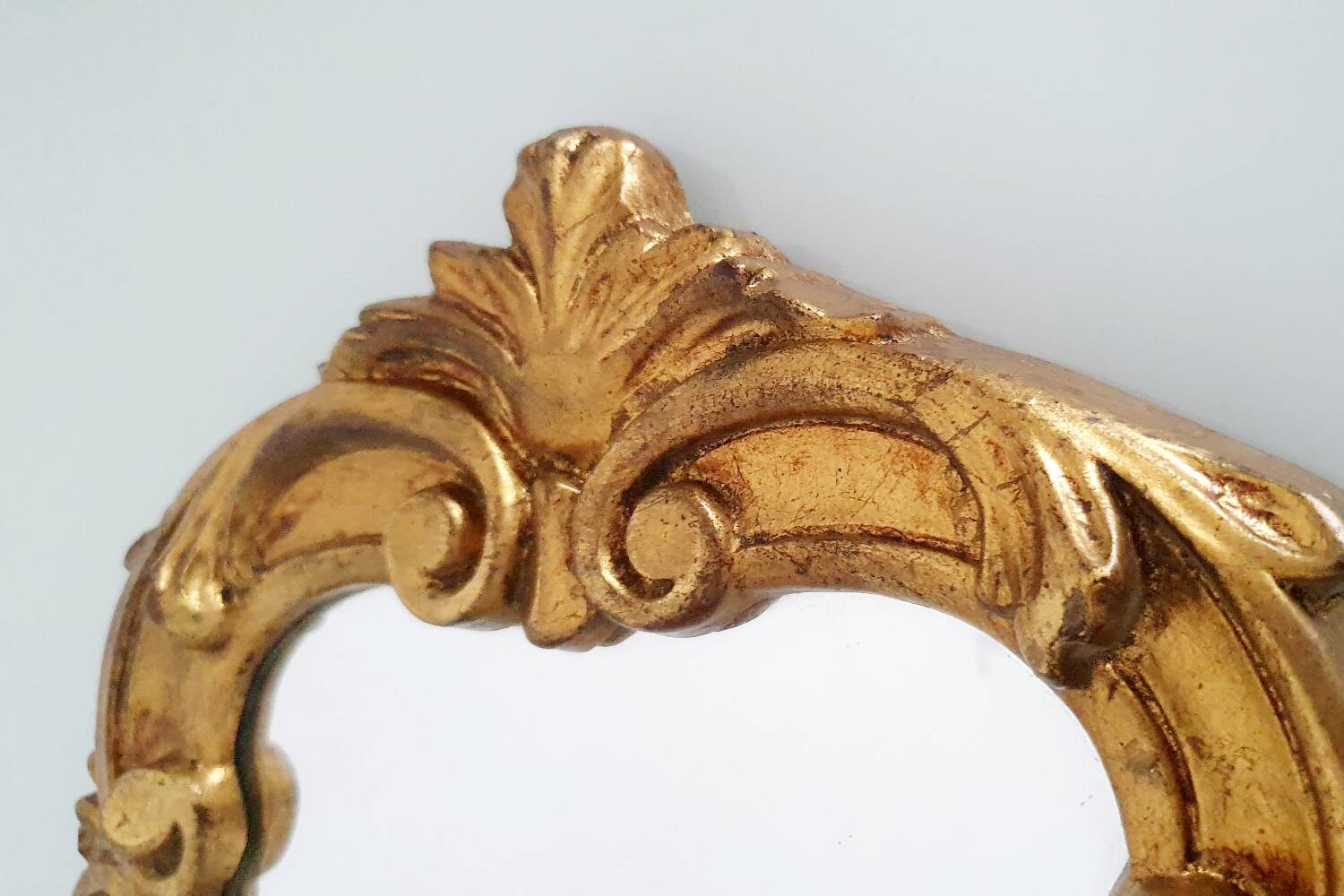 Baroque mirror gilded with gold leaf