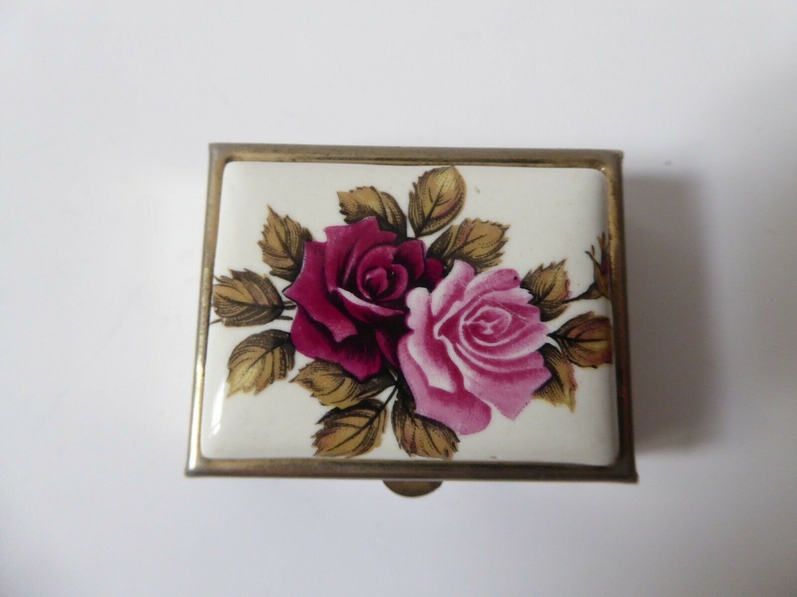 Metal and porcelain pill box roses decorations