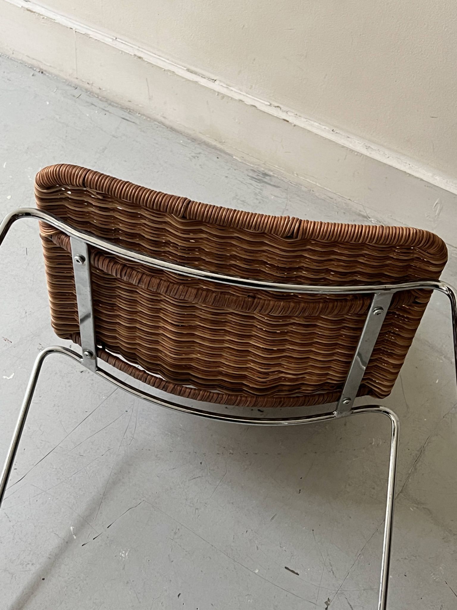 Chair made of rattan, wicker and chrome-plated metal