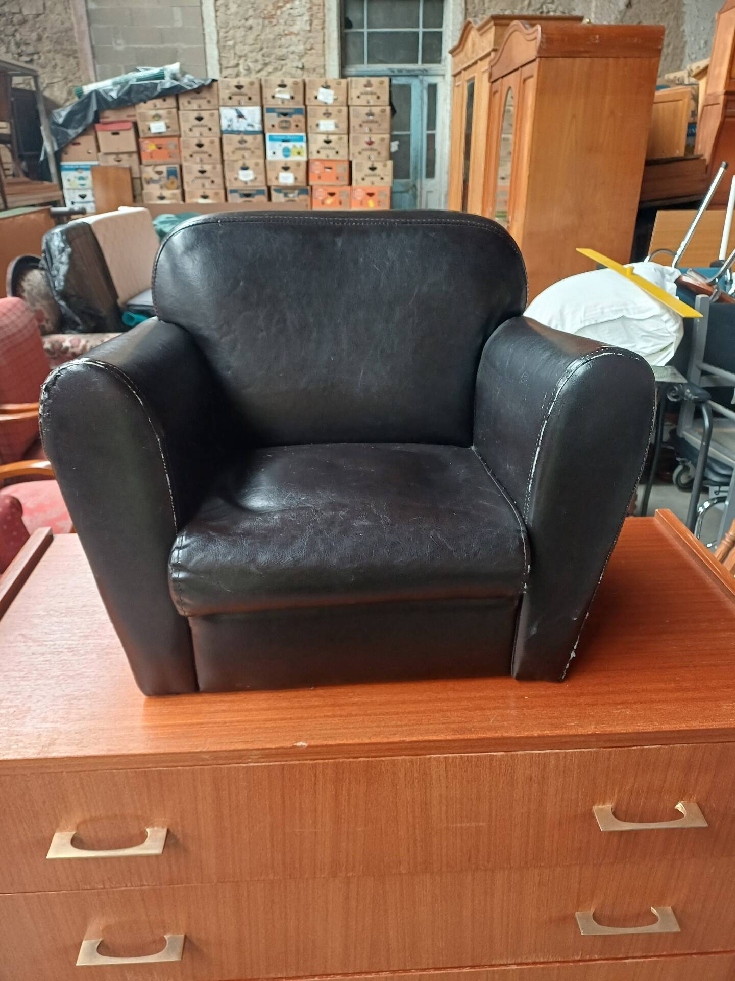 Mini black leather armchair for children