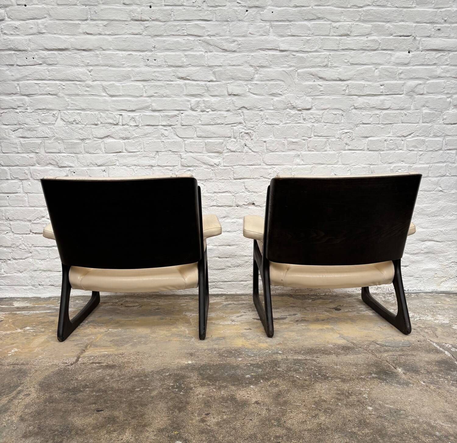 Set of two Baumann sled lounge chairs.