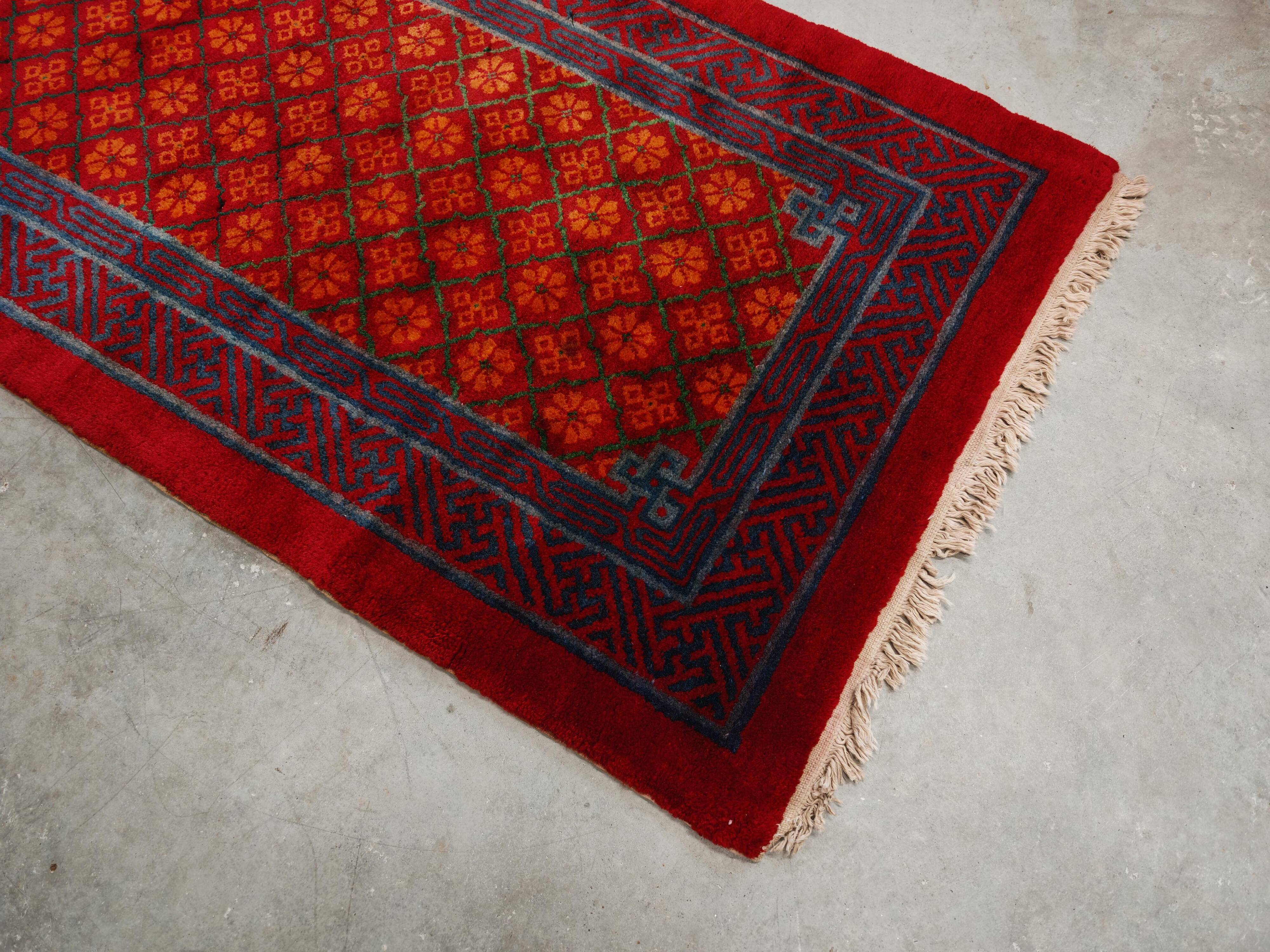 Ancient Khotan carpet, hand-knotted, floral pattern, Turkestan, 1960s.