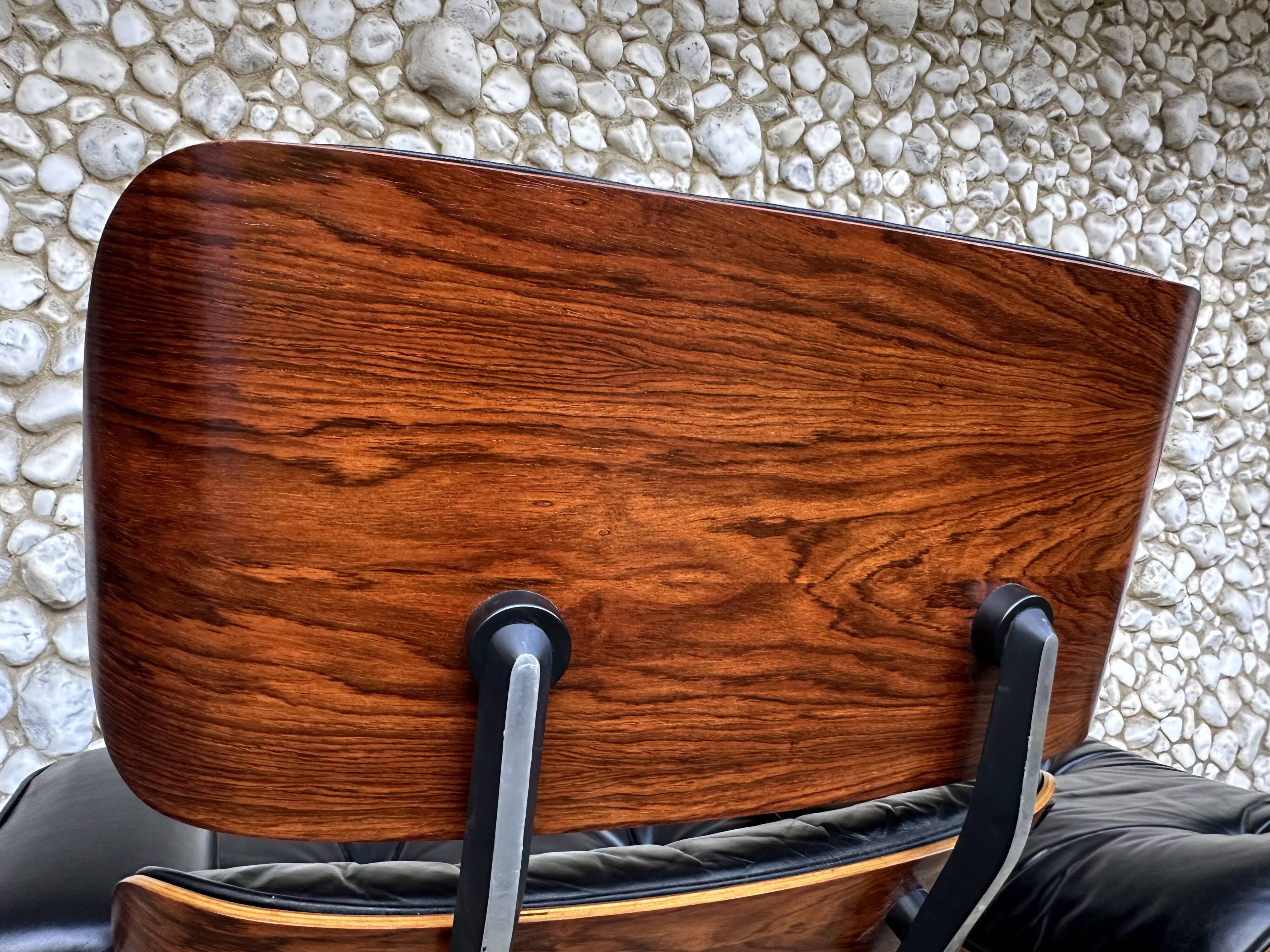 Fauteuil Lounge et ottoman Herman Miller Charles & Ray Eames, palissandre