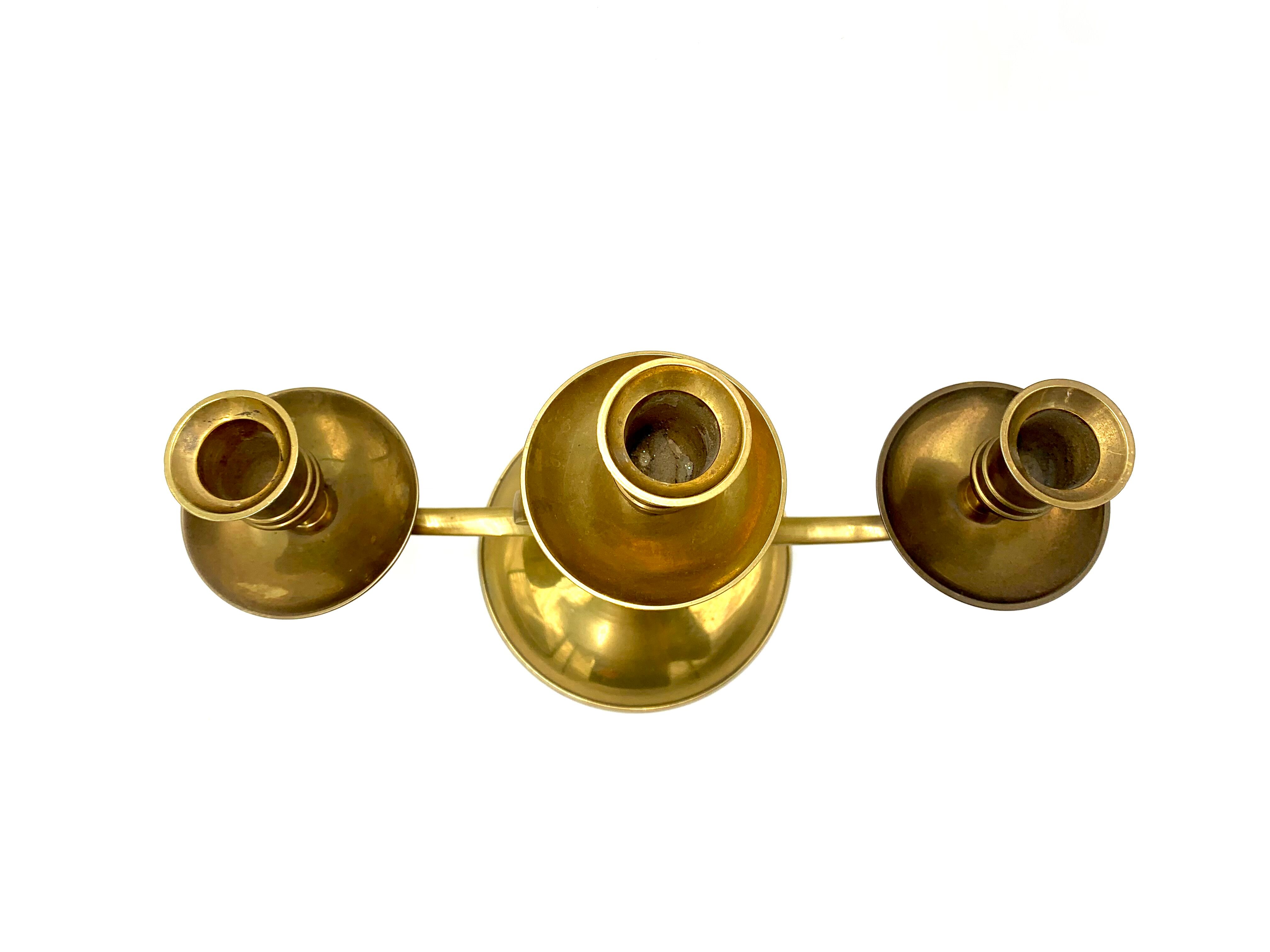 Brass three-arm candlestick