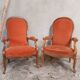 Deux fauteuils type Voltaire, en velours orange