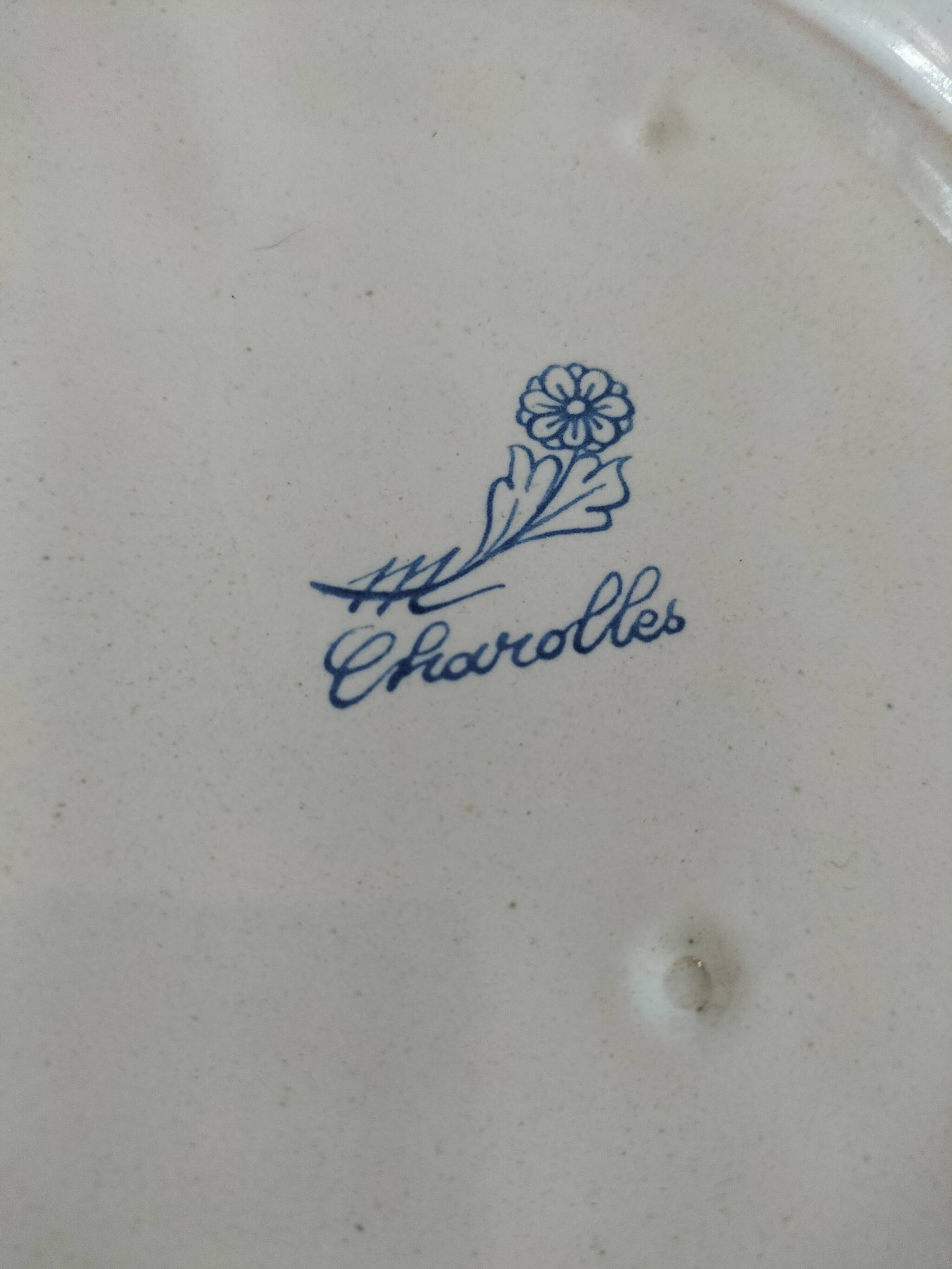 Decorative earthenware plate signed Charolles