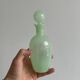 Opaque light green glass vial