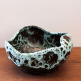 Empty pocket in black ceramic with green drip