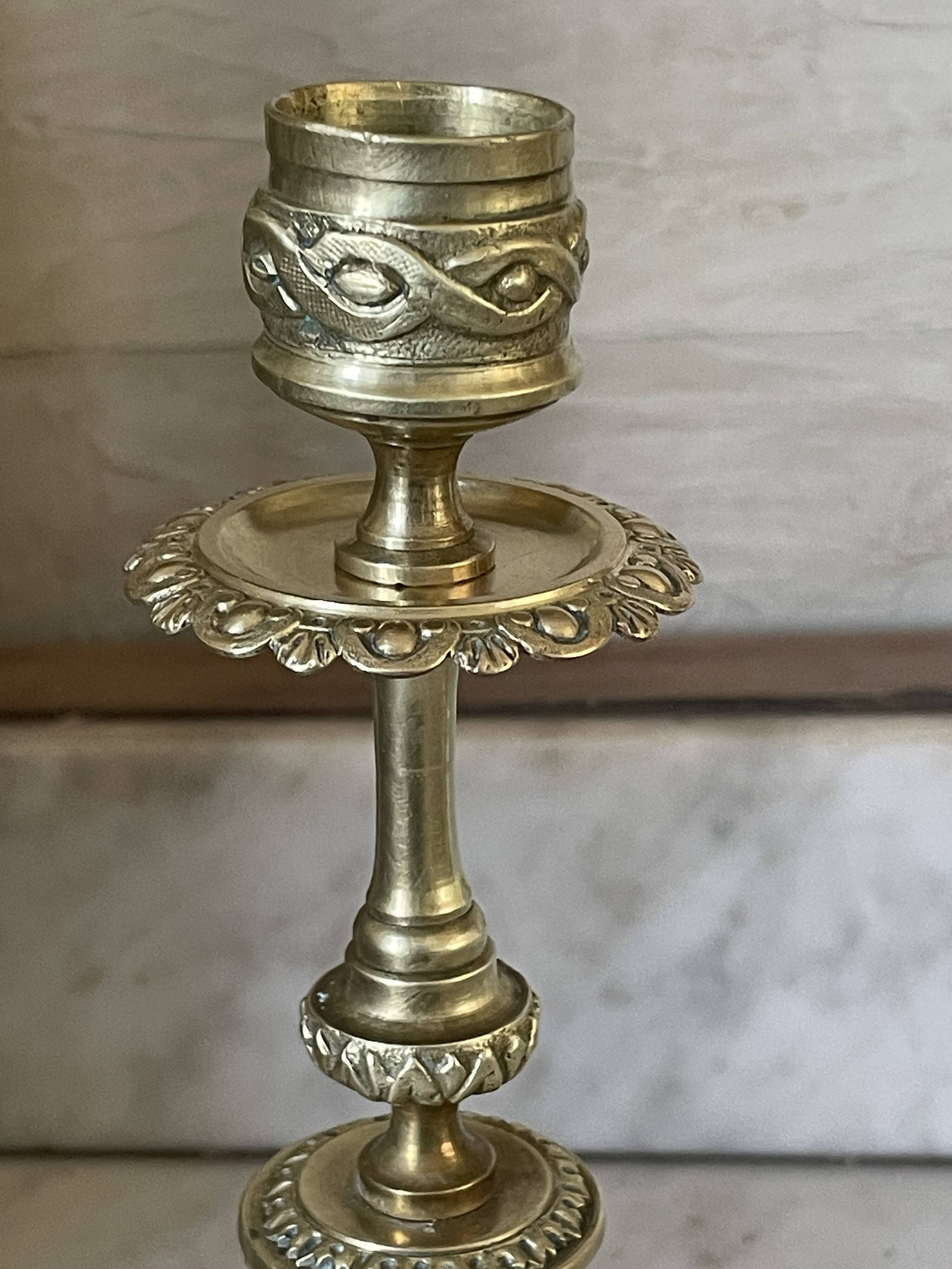 Pair of gilt bronze ram's head candlesticks, Louis XVI style, 19th century.