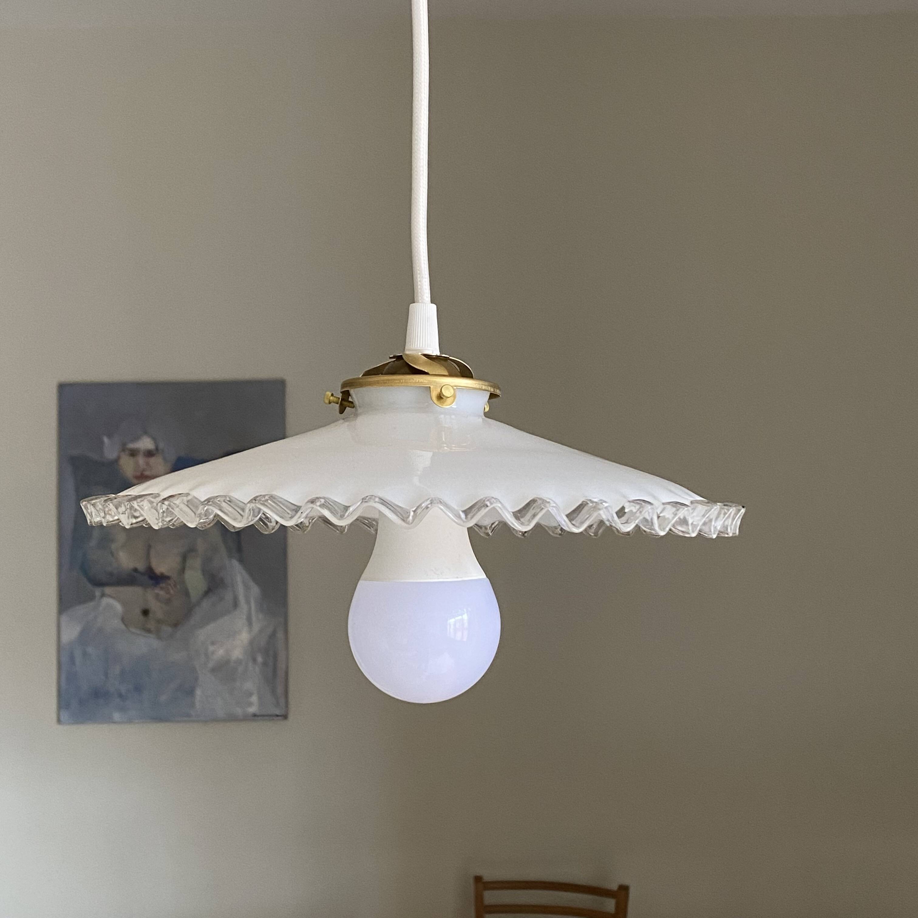 Old lampshade in white opaline glass with a wavy edge.
