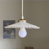 Old lampshade in white opaline glass with a wavy edge.