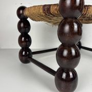 Brutalist wood turned bobbin low rush chair n the style of Charles Dudouyt