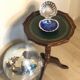Harness or pedestal table in wooden tripod foot and green leather top