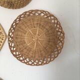 Wall composition of 9 wicker baskets and trays.