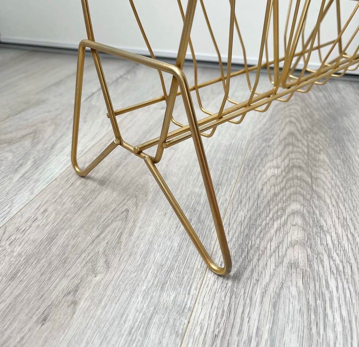 Vintage gold metal magazine rack