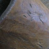 Antique hand carved mortar coffee table with circular glass top