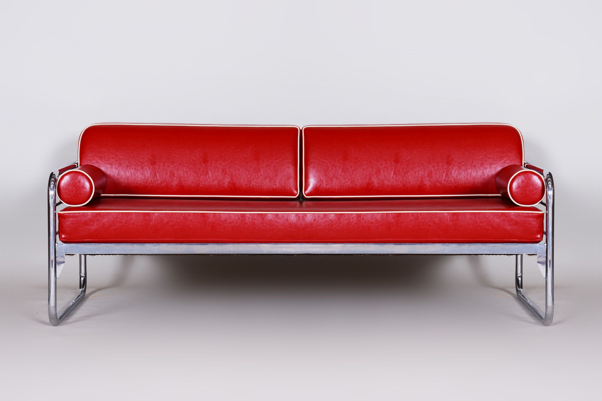 Red leather sofa by Hynekk Gottwald 1930