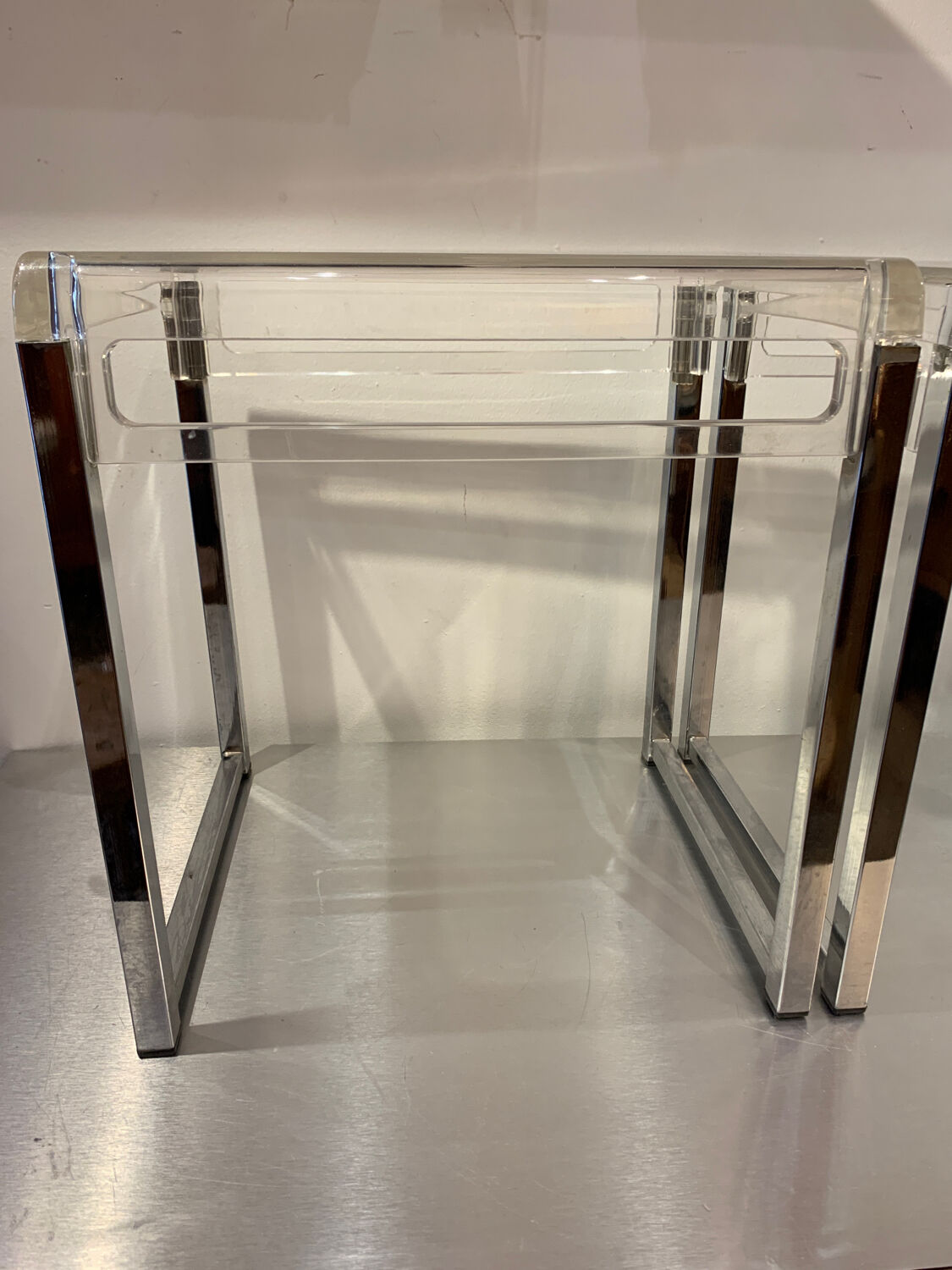 Pair of vintage chrome and acrylic glass bedside tables