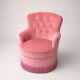 Vintage pink velvet buttoned armchair with fringes.