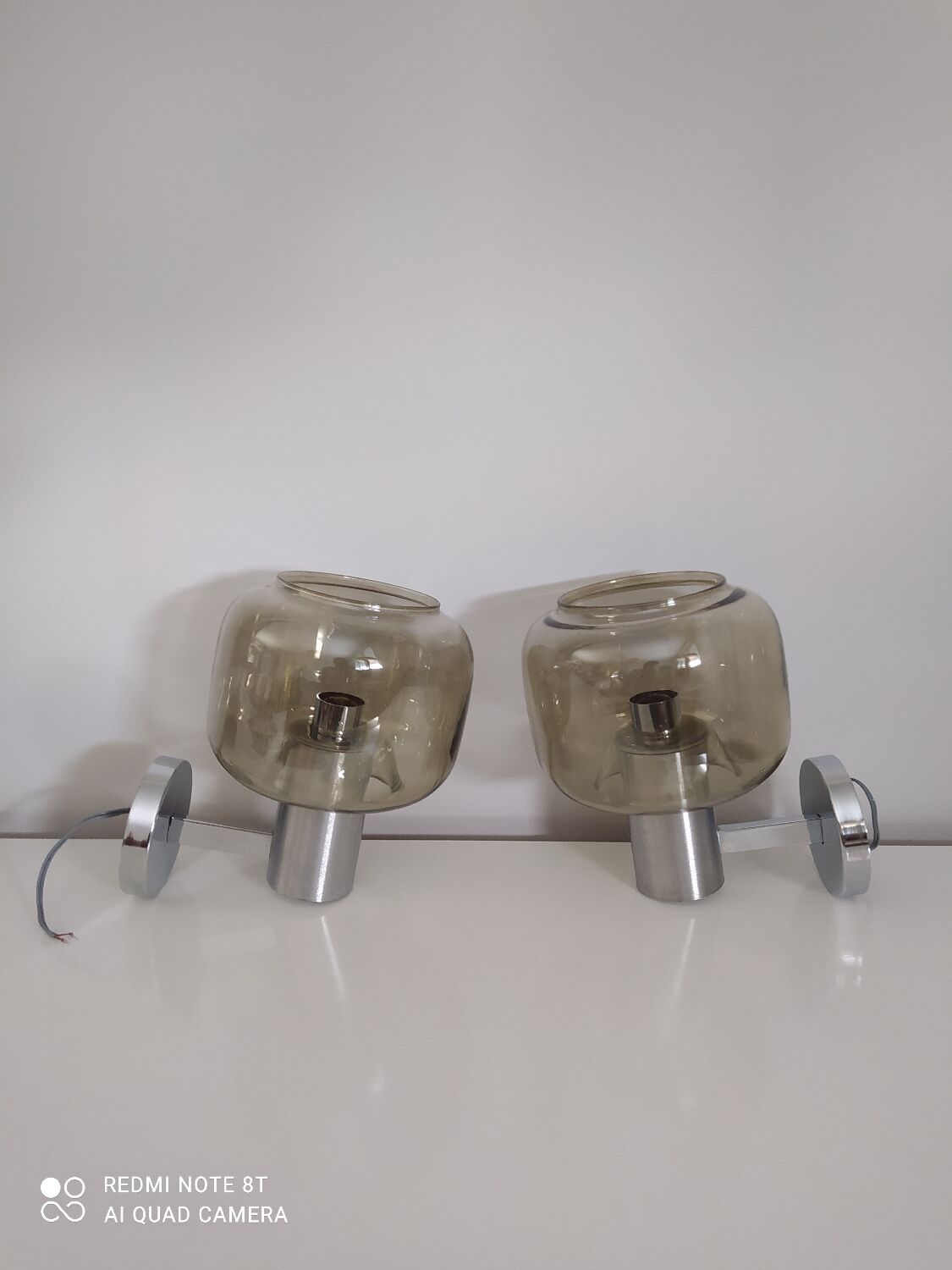 Pair of vintage chrome wall lights with smoked glass globe