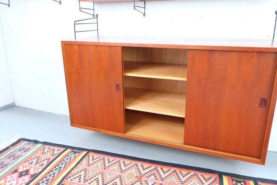 Nisse String shelf in teak, retro vintage style from the 60s-70s.