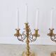 Pair of four-light candle holders in gilded brass