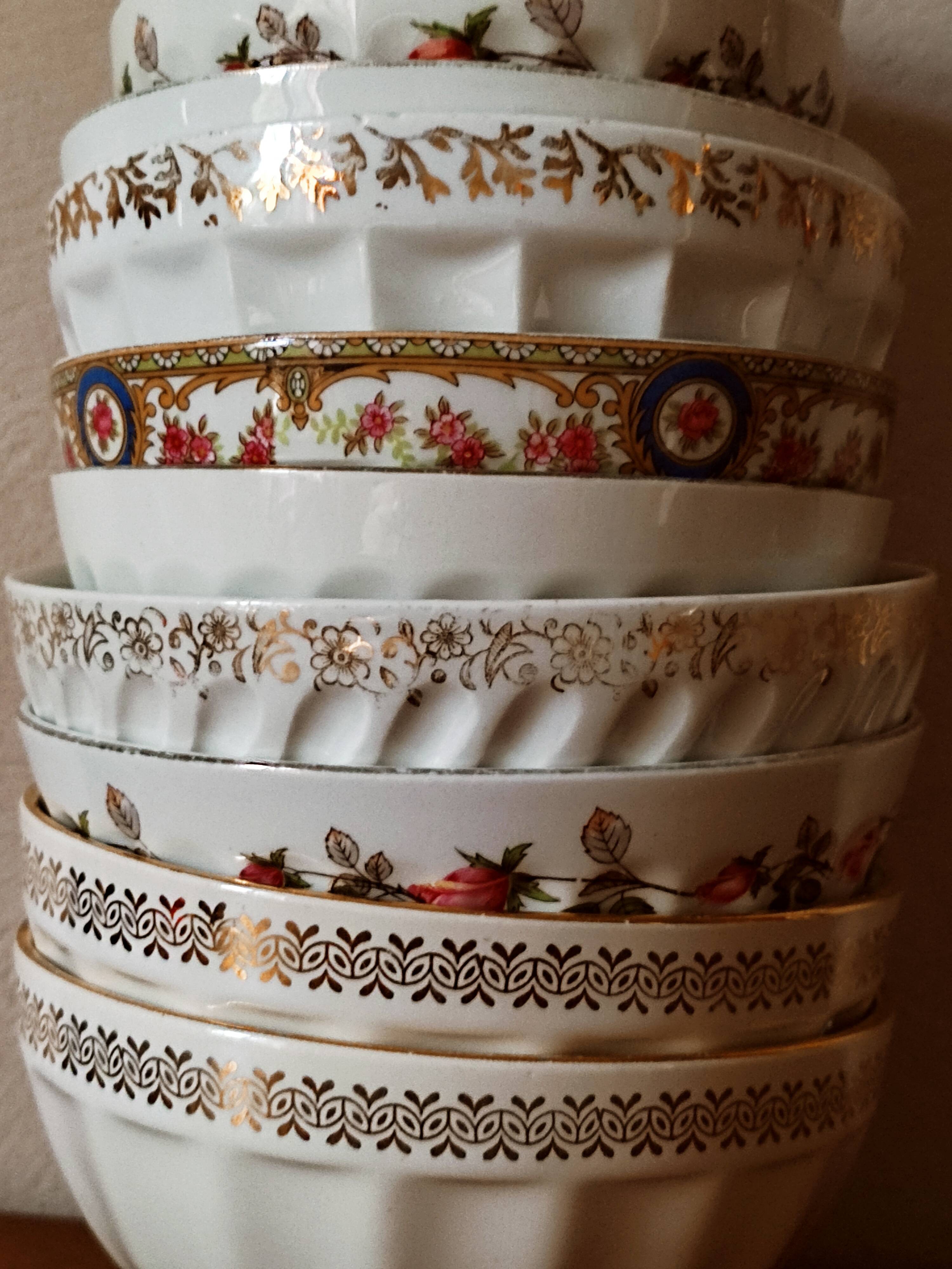 Set of 12 mismatched porcelain bowls