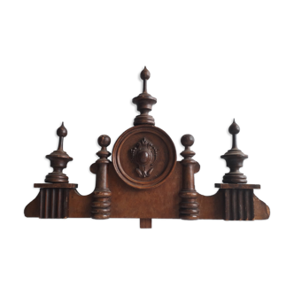 Old pediment in carved and turned wood