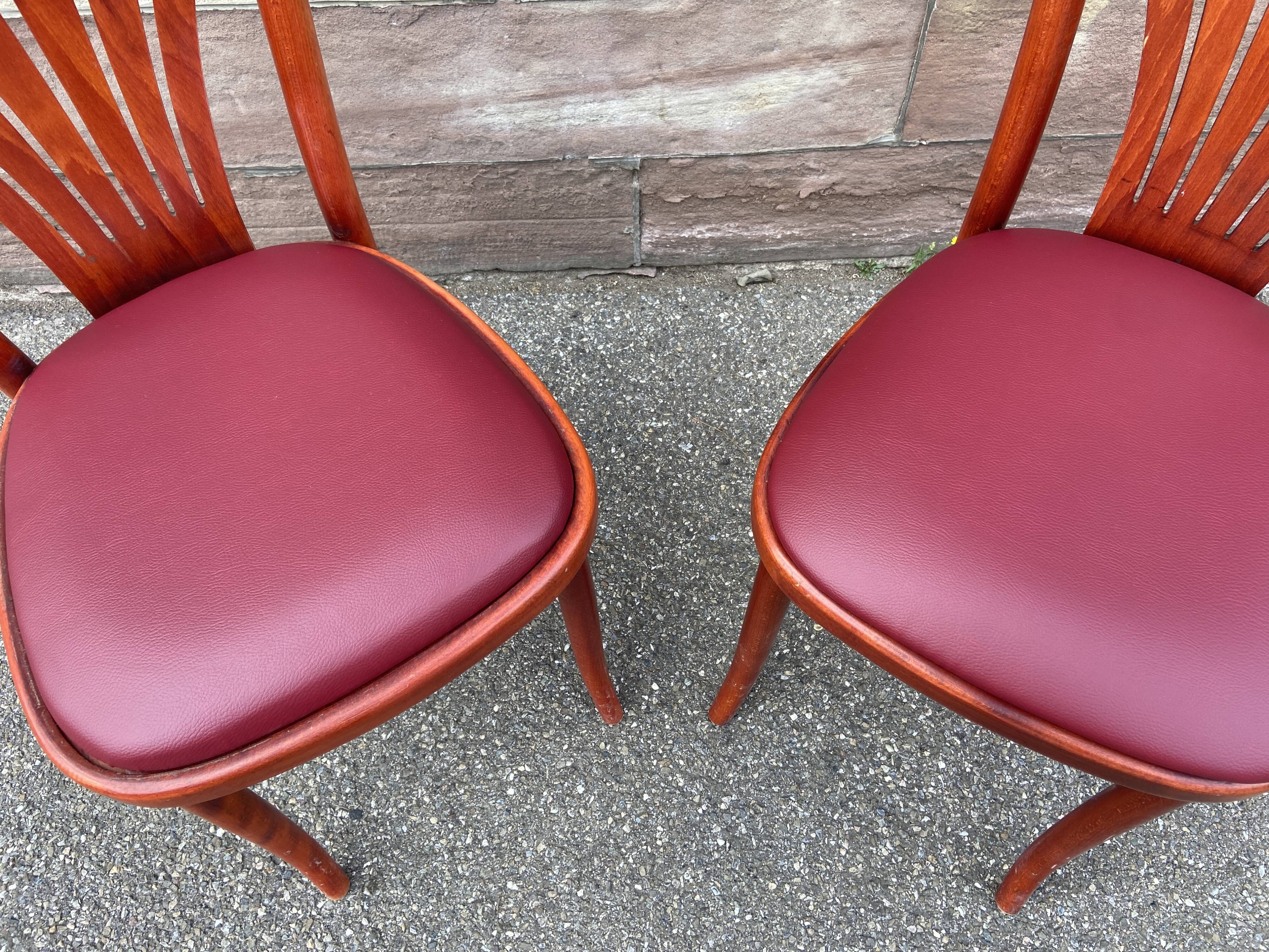 Pair of Alsatian bistro chairs in wood and leather, 1960