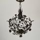 Patinated metal ceiling light with a floral and leaf pattern, 1950s, Italy.