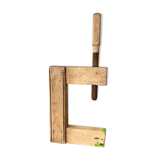Serre-joint ancien en bois brut, serre-livres