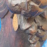 Round table in molded and carved oak with quill decoration, central shaft with 4 runners