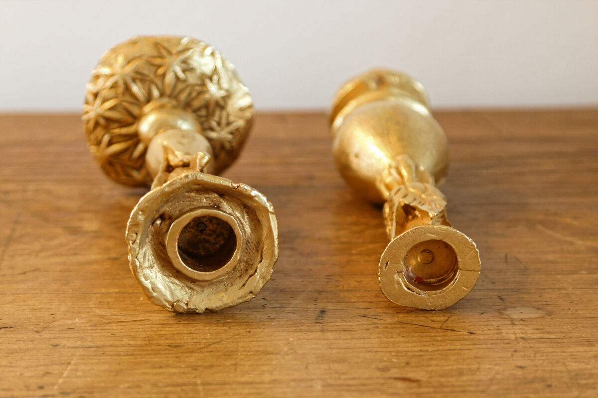 Pair of handmade candle holders, cast iron