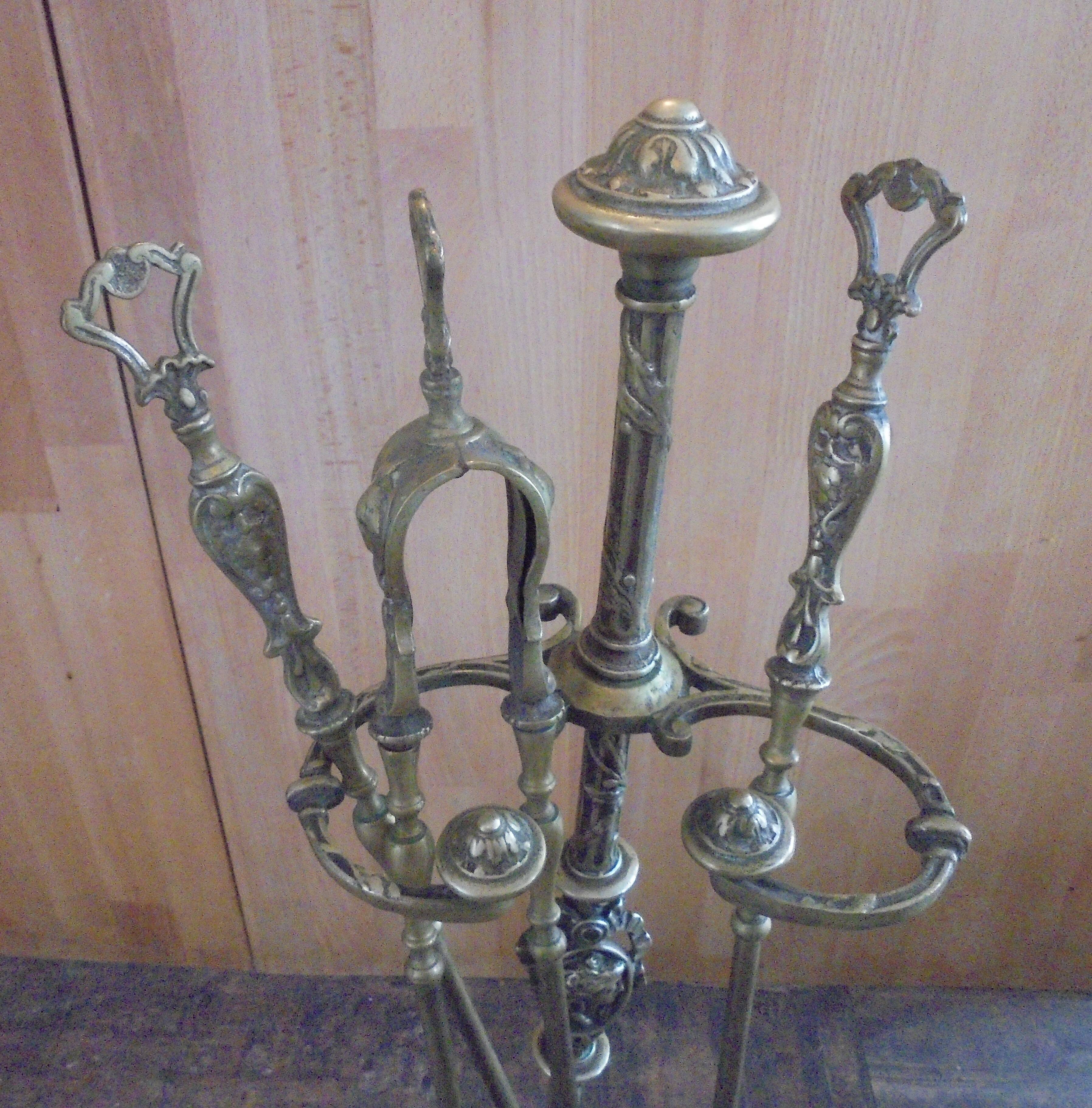 Old bronze fireplace servant decor medallion shovel clamp brooms