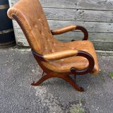 Chesterfield leather slipper chair with mahogany