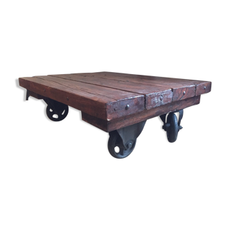 Industrial coffee table old solid wood with metal wheels