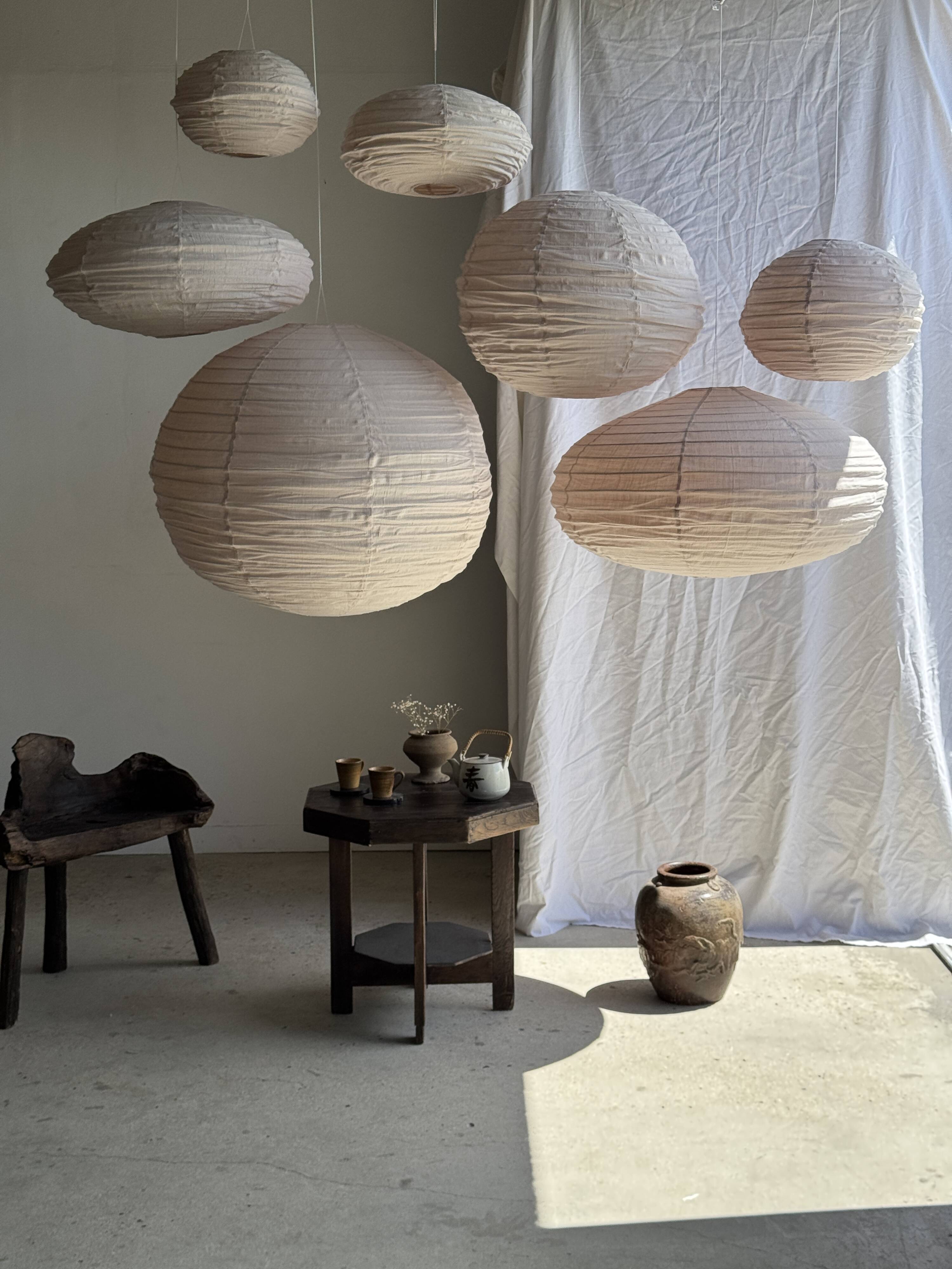 Large round pink Japanese-style suspension made of rattan and natural linen D60.