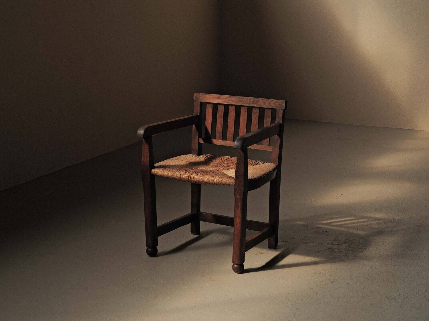 Handcrafted oak and straw armchair, France, circa 1950.
