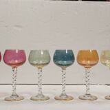 Set of 6 colored crystal stemmed glasses with gold twisted foot.