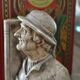 Book-clamps couple of realistic old men in plaster