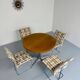 Old round table in solid wood and metal, vintage 70s design
