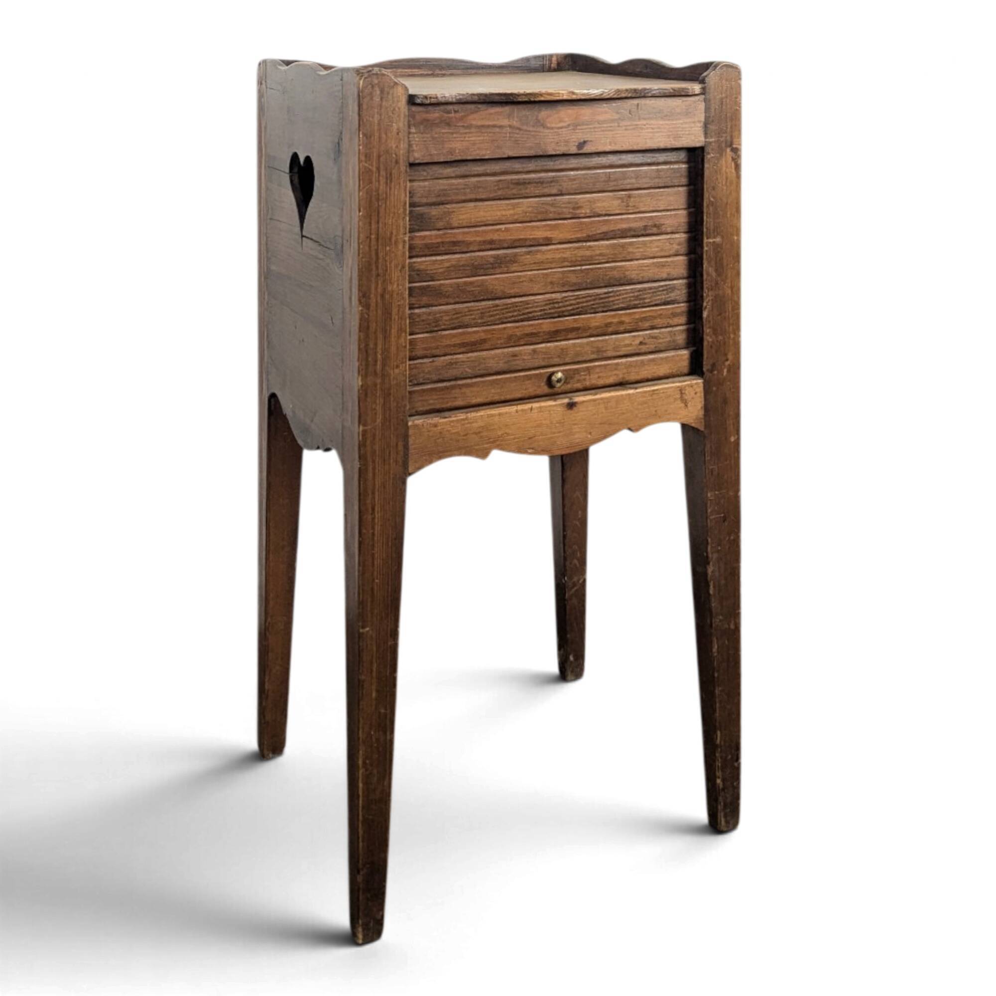 Louis XVI walnut bedside table with pierced hearts curtain