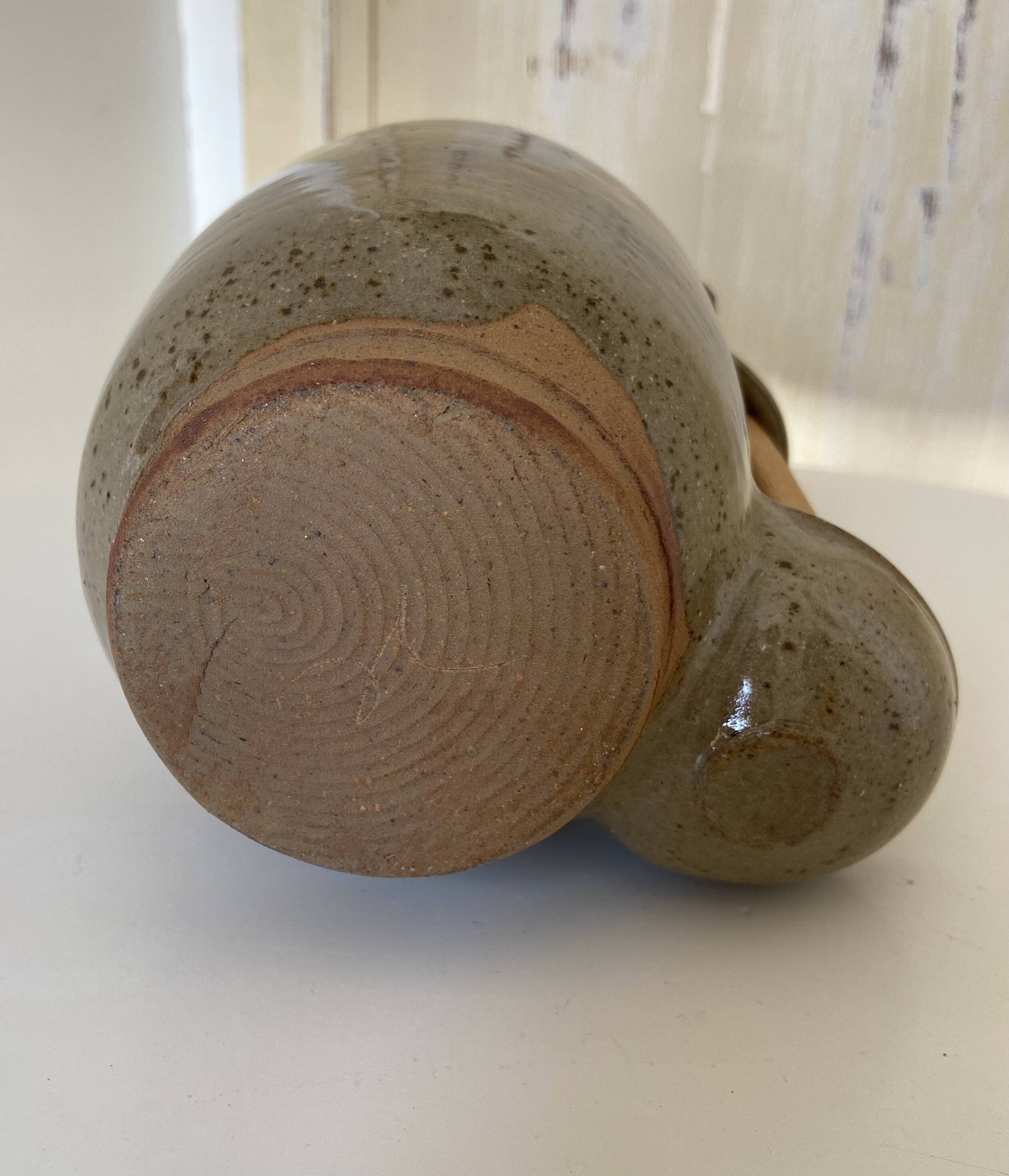 Old varnished stoneware pickle pot with tongs