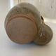 Old varnished stoneware pickle pot with tongs
